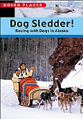 Dog Sledder Racing With Dogs In Alaska
