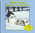 Sled Dogs Speeding Through Snow
